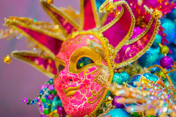  Carnival bright mask on a purple background.Carnival background with masks, feathers and glitter.