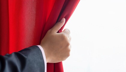 Human hand opening red curtain with white background