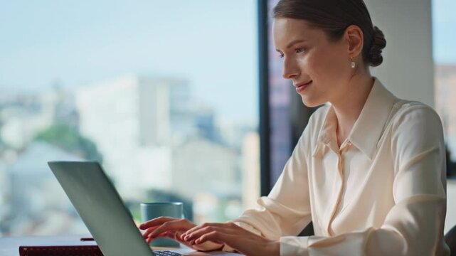 Confident woman typing laptop at home office closeup. Professional manager