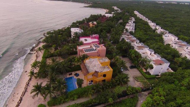 Aerial view showcasing a luxury resort along the beach in mexico, highlighting the stunning coastline and turquoise waters