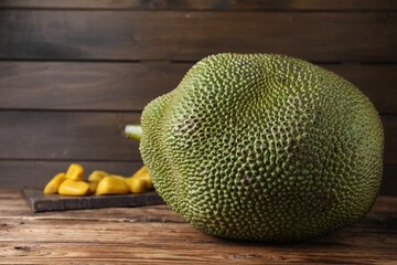 Fresh raw exotic jackfruit on wooden table