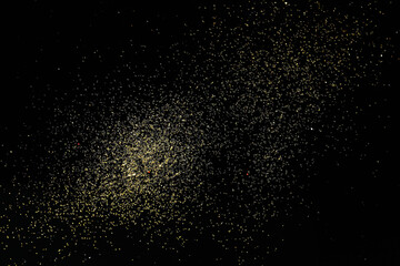 Beautiful shiny golden glitter on black background, top view