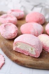 Tasty homemade mochi on white table, closeup