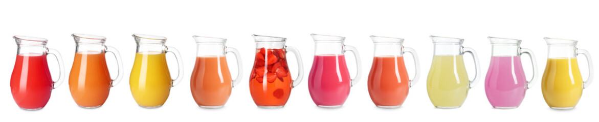 Glass jug with with different juices isolated on white, set