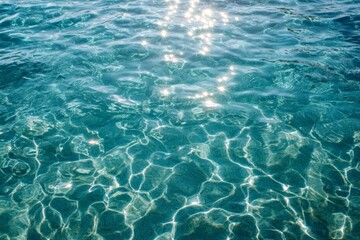 Obraz premium Bright sunlight reflecting off the clear water surface of a pool, inviting relaxation on a warm day