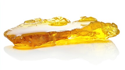 A translucent, amber-colored resin piece reflecting light.