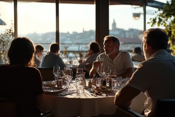 Fototapeta premium Dinner Gathering at a Riverside Restaurant During Sunset With Guests Enjoying Conversation and a Cozy Atmosphere