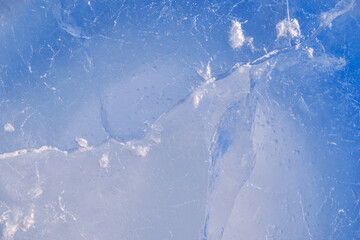 Texture of winter ice surface. Blue natural ice background