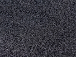 Fototapeta premium black sponge foam material surface background. textured absorbent material and coarse pores