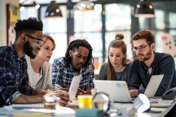 Diverse team working together in office, brainstorming and collaborating on project