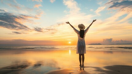 Fototapeta premium Silhouette of Joyful Woman with Arms Raised on the Beach at Sunset, Freedom and Travel Concept