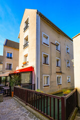 Obraz premium Residential buildings built in the Grand Morin river in Coulommiers in the French department of Seine et Marne in Paris region, France