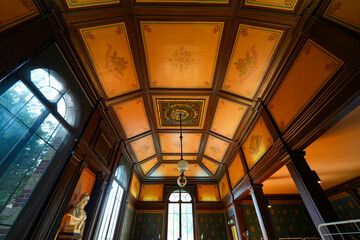 Obraz premium Monogram of the Menier family in the Menier City Hall of Noisiel in the workers' city built by the owners of the Menier Chocolate Factory, Seine et Marne, France