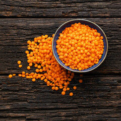 Organic red lentils in the bowl - Lens culinaris.