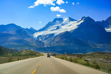 Road trip on the Icefields Parkway between Banff and Jasper passing by Mount Athabasca in Alberta,...