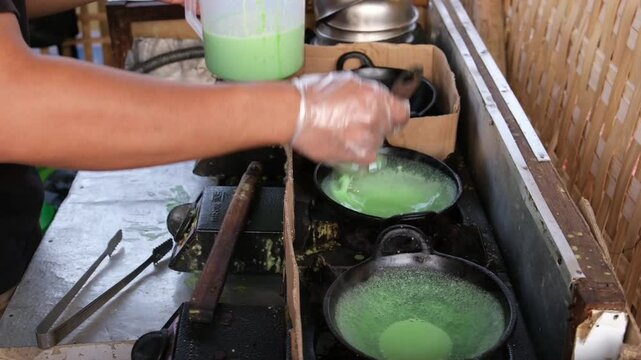 Kue Ape or Serabi Jakarta, made from rice flour with pandan leaf, Indonesian food
