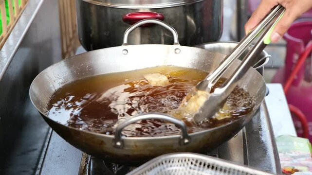 Batagor, made from fish or chicken dumpling, tofu, tapioca flour served with peanut sauce. Indonesian food
