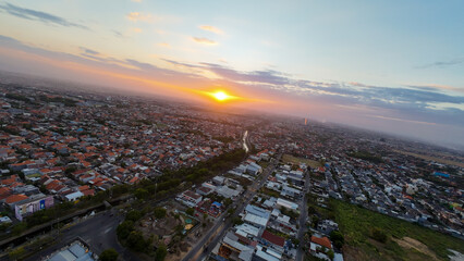 A city with a sunset in the background