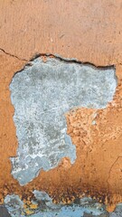 close up texture of torn orange wall with soft shadow 
