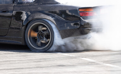 Race drift car burning tires on speed track. © toa555