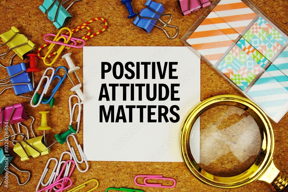 Poster positive attitude matters text on paper card with magnifying glass and stationery on cork board back