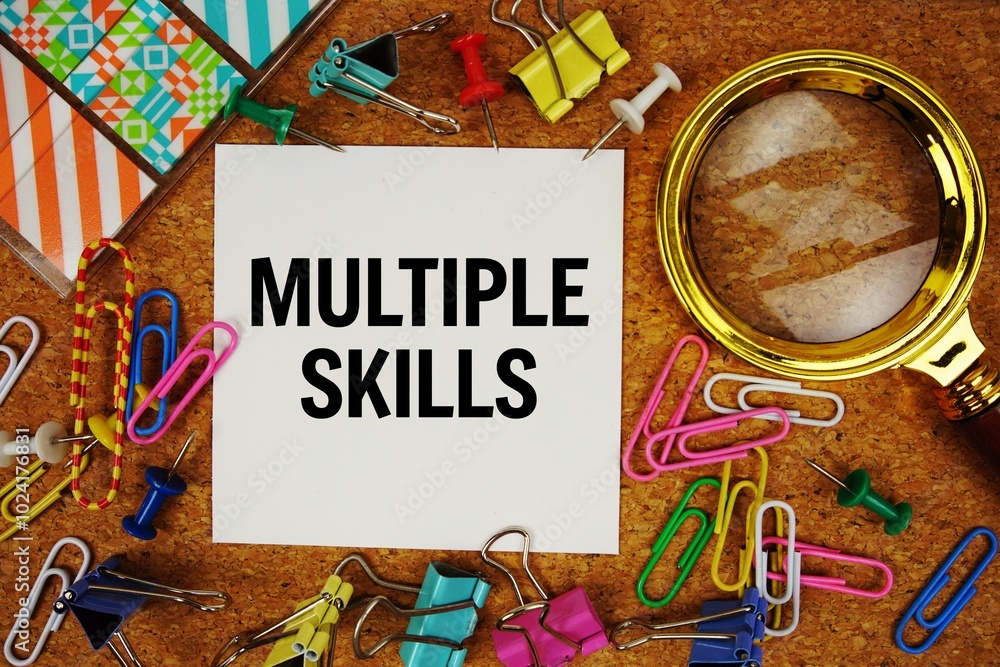Poster multiple skills text on paper card with magnifying glass and stationery on cork board background