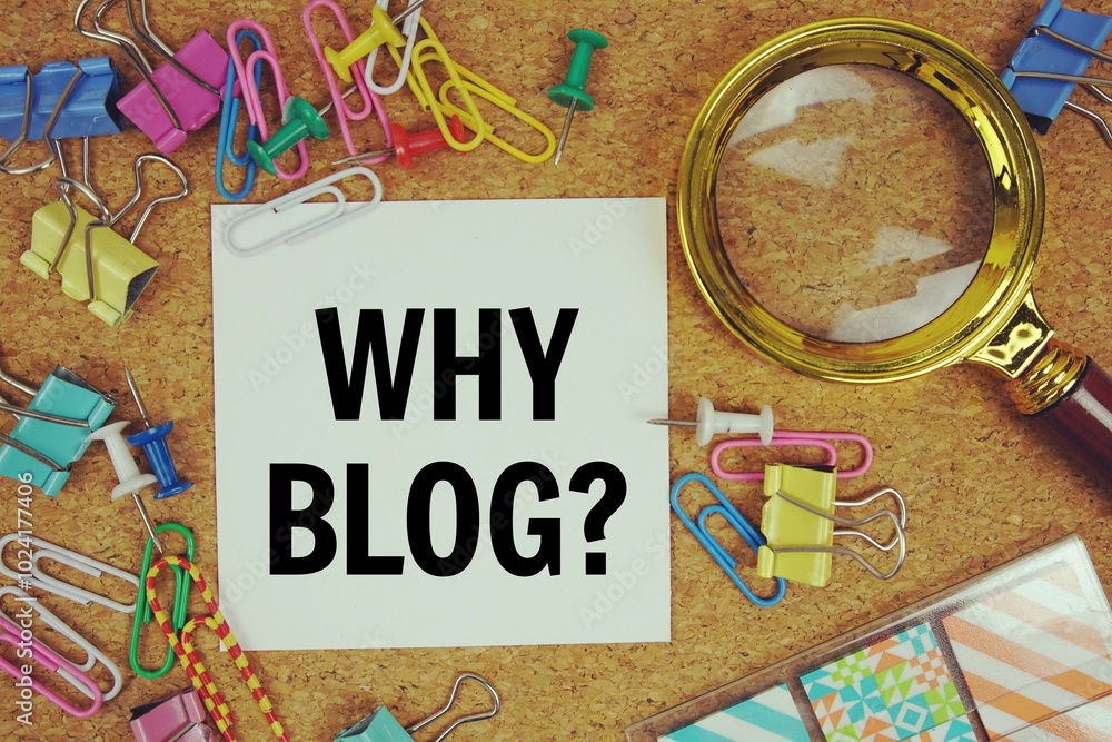Poster why blog? text on paper card with magnifying glass and stationery on cork board background