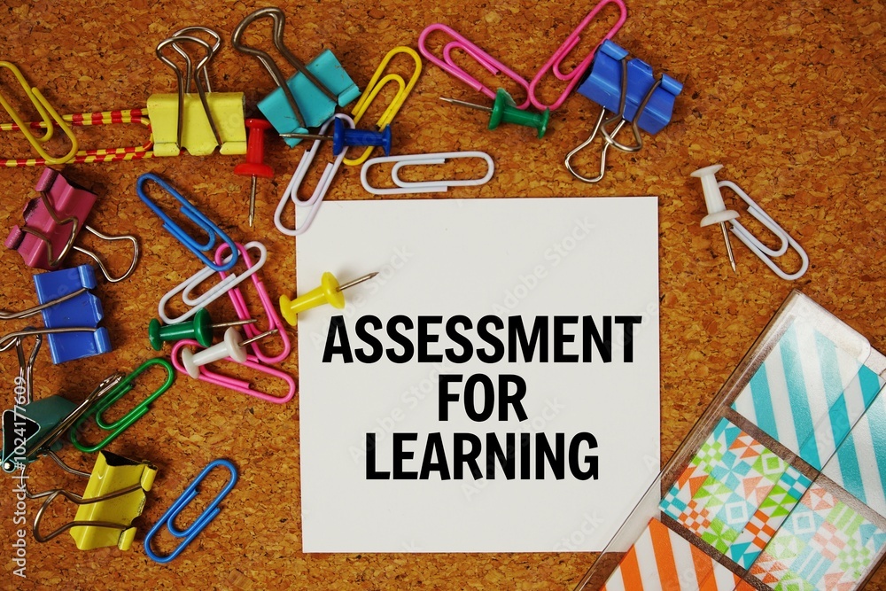 Poster assessment for learning text on paper card with stationery on cork board background