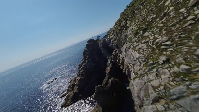 Drone Flying Around Pointe du Raz - Grand Site Of France On Atlantic Coast In Brittany. aerial FPV shot