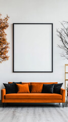 Orange velvet sofa with black pillows in front of a large empty frame.