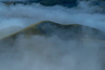 Mountain landscape in the fog.Beautiful sunlight and fog