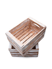 Small wooden box crate used for fruit or vegetables stand on top of each other. Isolated on a white background