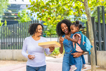 Three generation african family in a public park