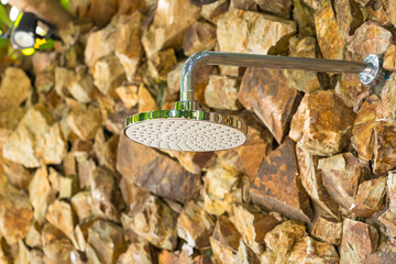 Natural Stone Wall and Modern Showerhead