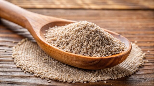 Close-up image of psyllium or plantago ovata on wooden scoop
