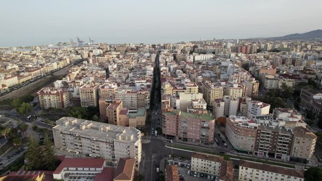 An Aerial View presents a cityscape of dense buildings and streets in an urban setting, Malaga, Andalucia, Spain