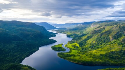 Captivating aerial perspective showcasing a winding river snaking its way through a picturesque rugged mountain valley  This sweeping