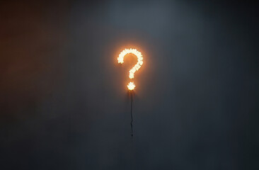 burning question marks in a dark room.