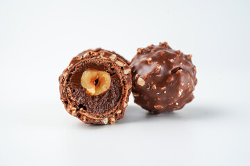 chocolate and hazelnut confectionery balls. chocolate sweet made. Chocolate candies in a gold wrapper