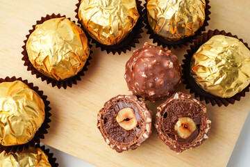 chocolate balls filled with hazelnuts, chocolate sweets in a gold wrapper