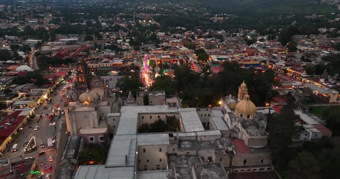 Orbital drone video starting from the rear and concluding on the side of the ex Jesuit college in Tepotzotl&aacute;n, now the National Museum of the Viceroyalty, with the main square in the background