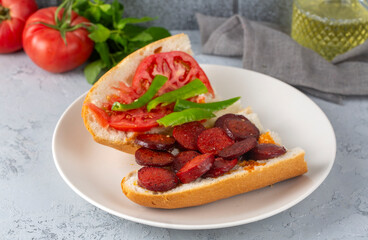Grilled chili, tomato and sucuk between bread. ( Sucuk ekmek )