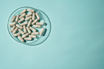 medicine capsules pills in a petri dish, supplements vitamins, Assorted pharmaceutical medicine
