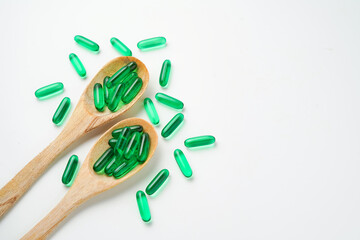Softgels green, supplements, fish oil, omega 3, vitamin D3, vitamin E oil filled capsules