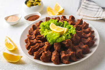 Traditional delicious Turkish food; Turkish name; Cig kofte (raw meatball in Turkish) with lettuce