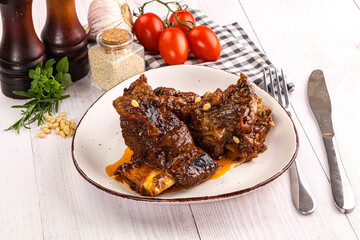 Prepared tasty beef ribs with sauce