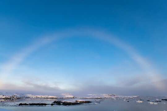 White rainbow in Antarctica over the ocean