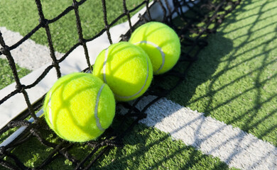 Closeup of the tennis ball on the net