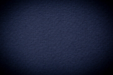 close up of dark blue cardboard shadowed at edges