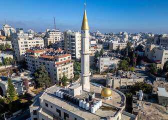 Fototapeta premium Gold-clad minaret at a mosque in downtown Ramallah, the capital of the Palestinian Territories in the West Bank